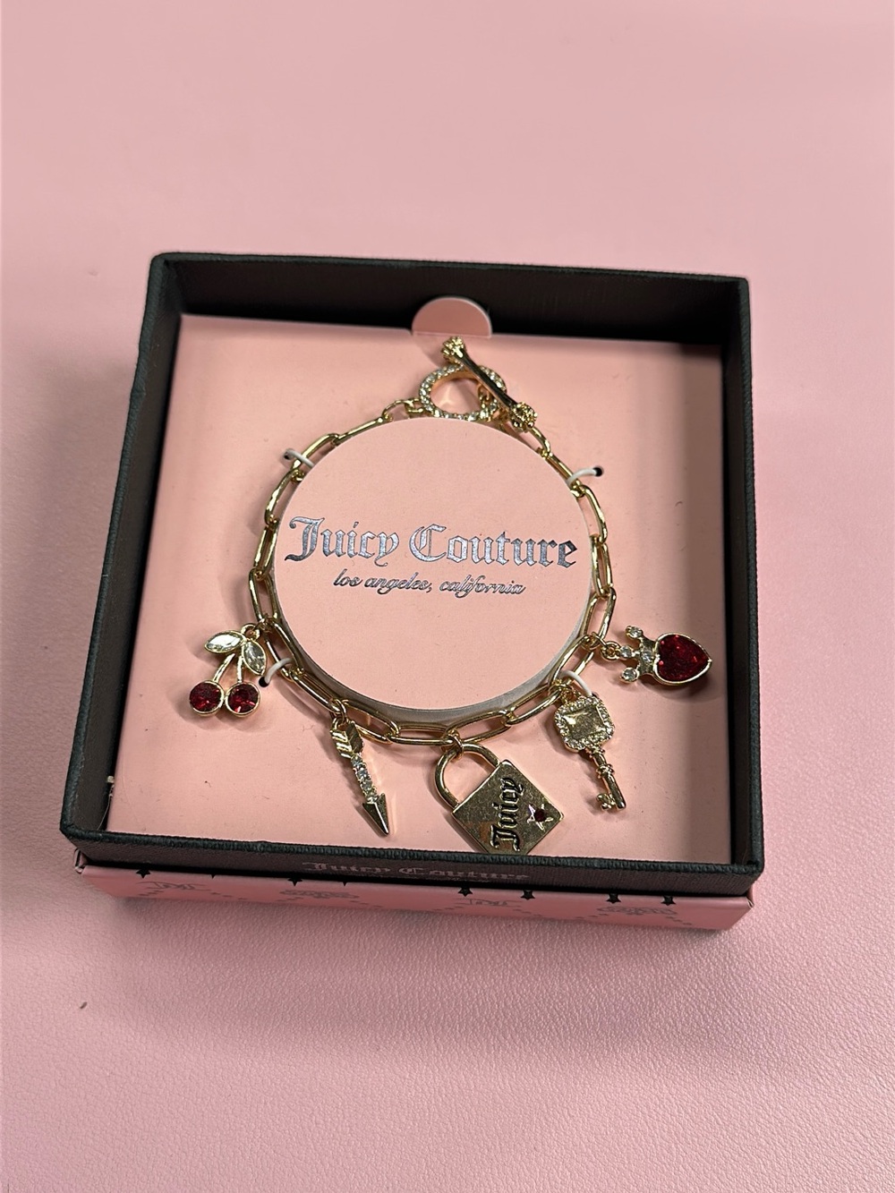 Juicy Couture Gold Charm Bracelet with Red Accents Cherry Charms